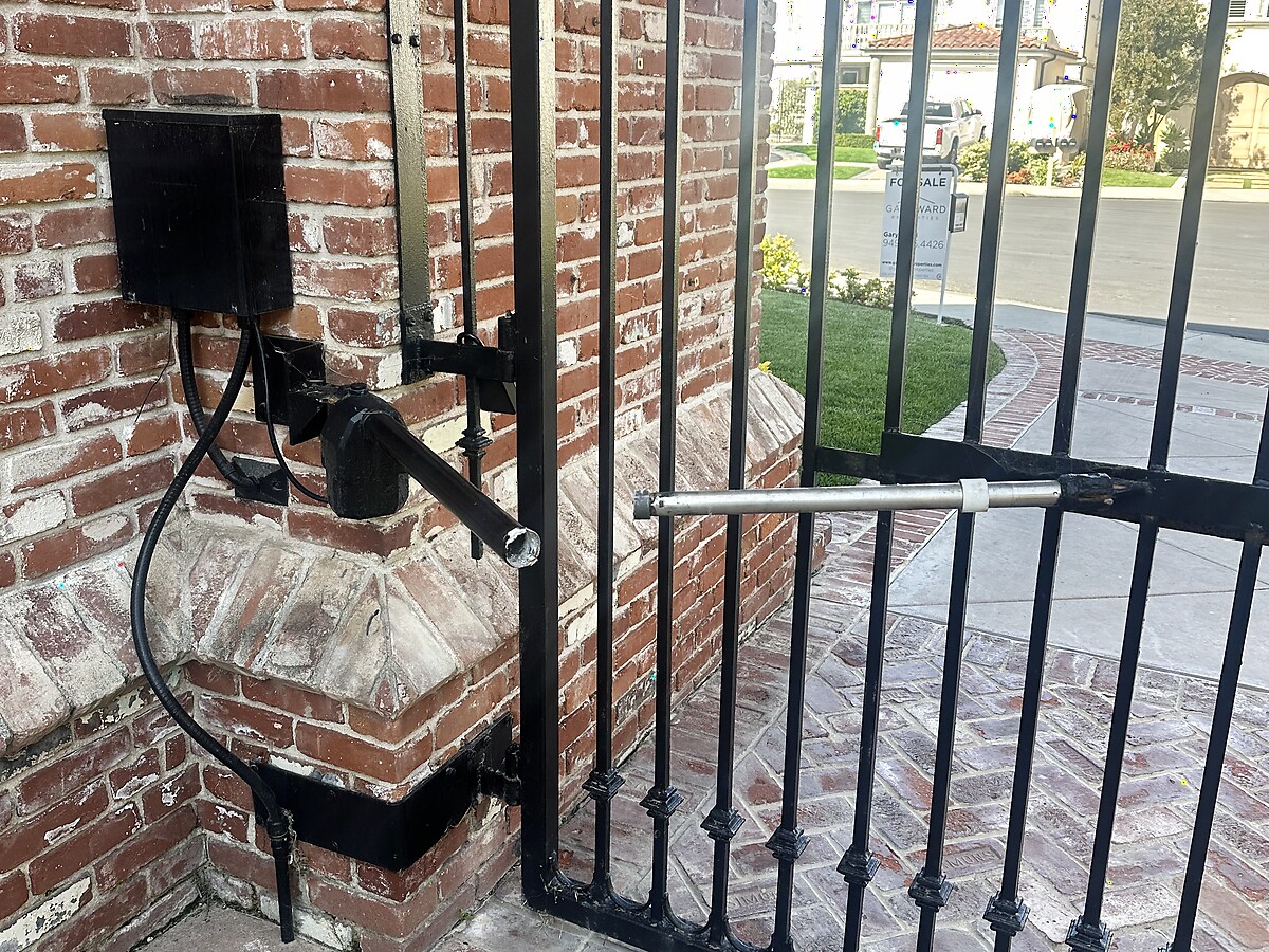 Before: driveway gate install & repair problem on a Sacramento area garage door