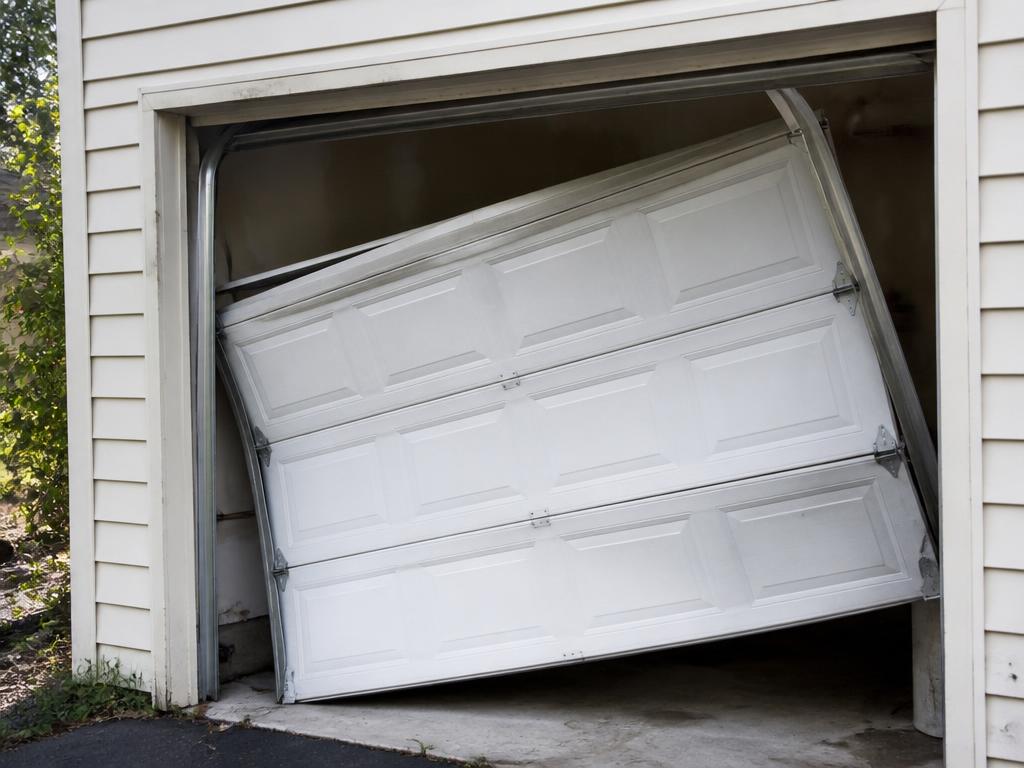 Before: roller & maintenance tune-up problem on a Sacramento area garage door